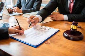 business people and lawyers discussing contract papers.Legal planning. Concepts of law, advice,...