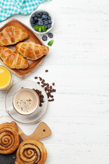 Coffee, juice and croissants breakfast - obrazy, fototapety, plakaty