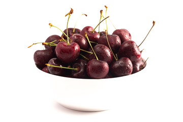 Bowl Full of Dark Cherries Isolated on a White Background