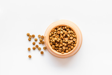 Puppy dry food on white background top view mockup