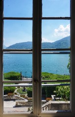 Fototapeta na wymiar View of Lake Como from the window of an old villa.