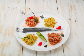 ceviche. Three colorful shrimps ceviche with mango, avocado and tomatoes. Latin American Mexican Peruvian Ecuadorian food.