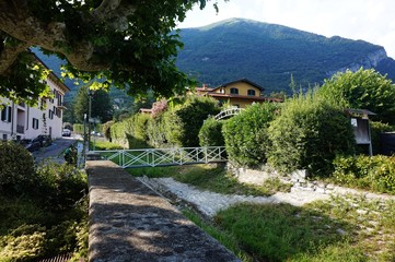 Fototapeta na wymiar View of Lake Como from the shore of Lenno.