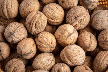 Natural background of many walnuts, top view