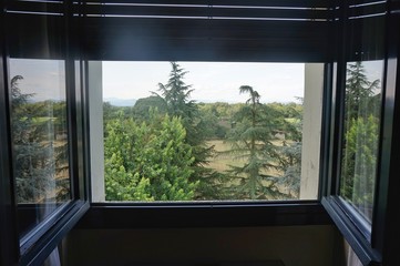 Open window with a view of the mountains.