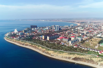 Fototapeta na wymiar Flying over the coastal city in mountains Anapa in Russia, aerial view.