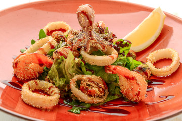 salad of fried seafood, with fresh vegetables
