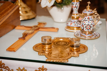 Church accessories for baby baptism with cross on icons background