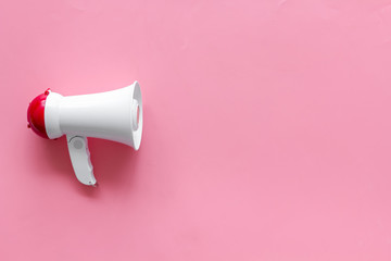 megaphone for advertising and announcement on pink background top view copyspace