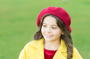 Fototapeta premium So beautiful. autumn fashion style. fall season. happy childhood. small child with curly hair. parisian girl kid in french beret. beauty and fashion. autumn coat. cheerful little girl in yellow coat