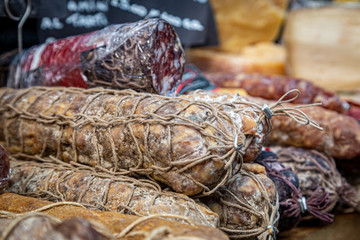 Cured meats for sale on a market stall