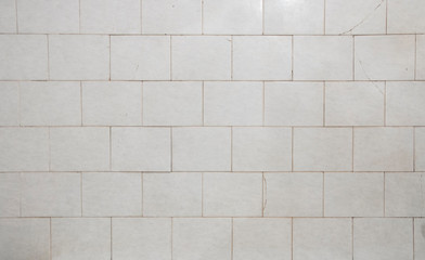 Naklejka premium old white tiled wall background