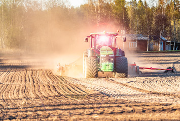 Swedsih farmer drives at the spring field, he uses a tractor to seed wheat. Modern Swedish ecological agriculture, nearby Umea city, Northern Sweden © Alexandre Patchine