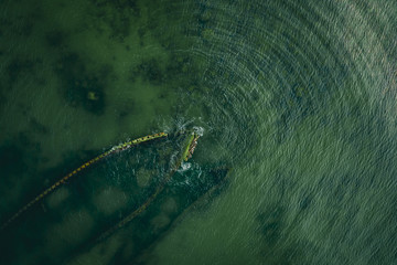 An aerial view of the shipwrecks with radial waves near Paljasaare, Tallinn, Estonia