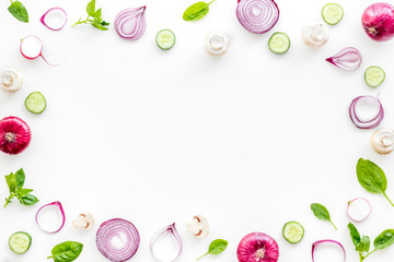 Sliced, cut, chopped vegetables frame on white background top view copyspace