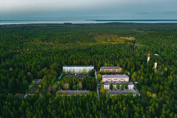 Forest town at dusk. Small remote former Soviet military town Suurpea in the middle of forest of Lahemaa national park. Estonia, Europe