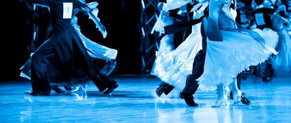 woman and man dancer latino international dancing. Blue filter