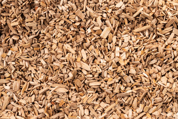 Background in the form of wood chips light brown, top view