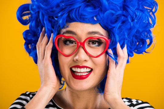 Fun and colorful portrait of woman with blue wig