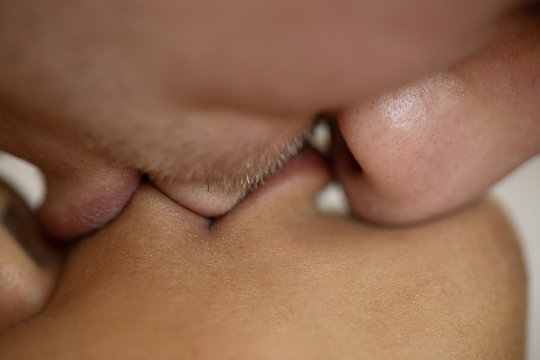 Close up portrait of young couple kissing