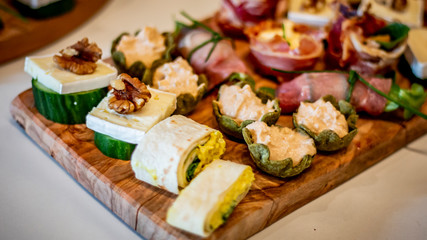 Table in the yard full of different finger food ready for the party. Catering concept