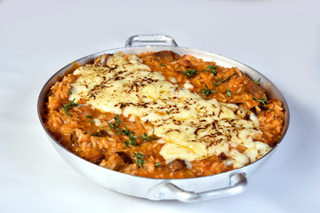 Sausage Risotto, Italian risotto served with Italian sausage and onion pepper mix ,tossing in spicy tomato sauce topped with parmesan cheese