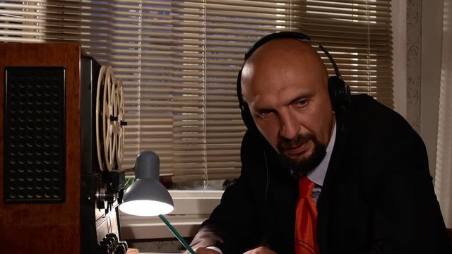 KGB agent overhears and records an important conversation on tape