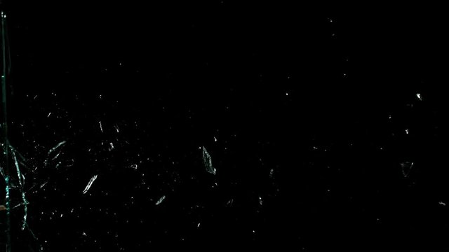 Real glass side break in super slow motion isolated on black background, 1000fps. Shooted with high speed camera at 4K.