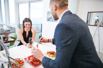 Young couple cooking at home together