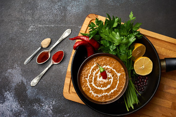 Dal Makhani at dark background. Dal Makhani - traditional indian cuisine puree dish with urad...