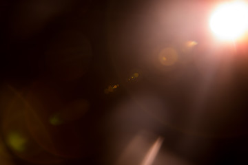 Abstract Natural Sun flare on the black background.