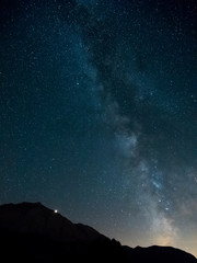 Milky Way with Mars rising behind the mountain, Engadine, Switzerland.