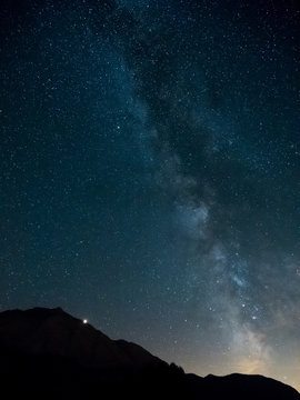 Milky Way with Mars rising behind the mountain, Engadine, Switzerland. © Niccolò Castellani