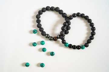High angle view on crystal semiprecious stone beads bracelets gems natural stones for manifesting...