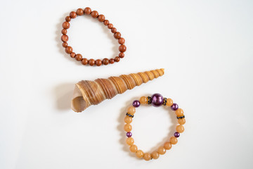 High angle view on crystal semiprecious stone beads bracelets gems natural stones for manifesting...