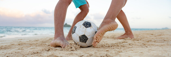 Soccer sport fun playing friends kicking ball with feet on beach panoramic banner background.
