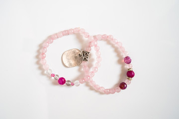 High angle view on crystal semiprecious stone beads bracelets gems natural stones for manifesting and healing energy handmade for good fortune on the table