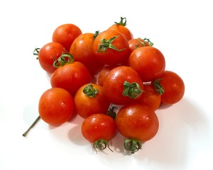 Close-up shot to a bunch of fresh cherry tomatoes