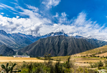 Fototapeta premium Sacred Valley, Peru - 05/21/2019: The inescapable snow peaked Andes in the Sacred Valley of Peru.