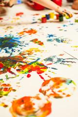 Kids playing with paint and fingerprints