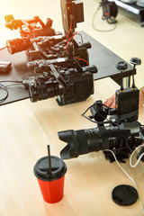 Behind the scenes of filming movies and video products, setting up equipment for shooting video and sound. The concept of producing video content for social networks, TV and blogs.