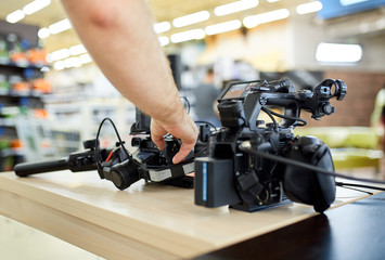 Behind the scenes of filming movies and video products, setting up equipment for shooting video and sound. The concept of producing video content for social networks, TV and blogs.