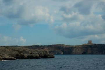 Malta beach with rocks and blue water