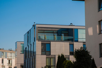 Simple light square houses in Europe. Summer