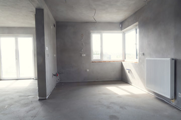 Interior of the building in the developer state. Finishing rooms.