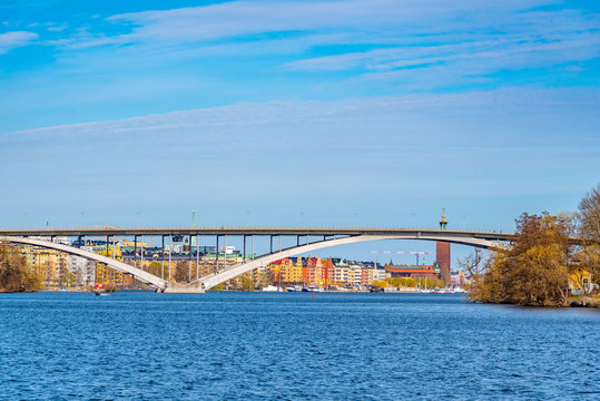 Waterfront of Stockholm with town hall at its end viewed through Vasterbron bridge, Sweden