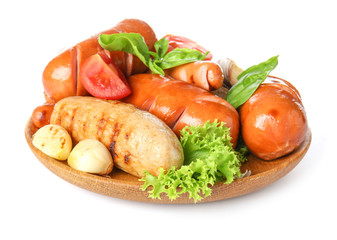 Plate with tasty grilled sausages on white background