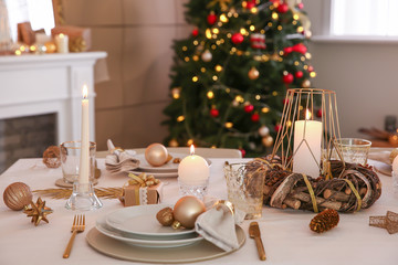 Beautiful table setting with Christmas decorations in living room