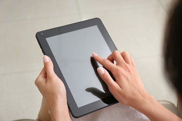 Young woman with tablet computer at home