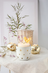 Composition with beautiful burning candles and flowers on table